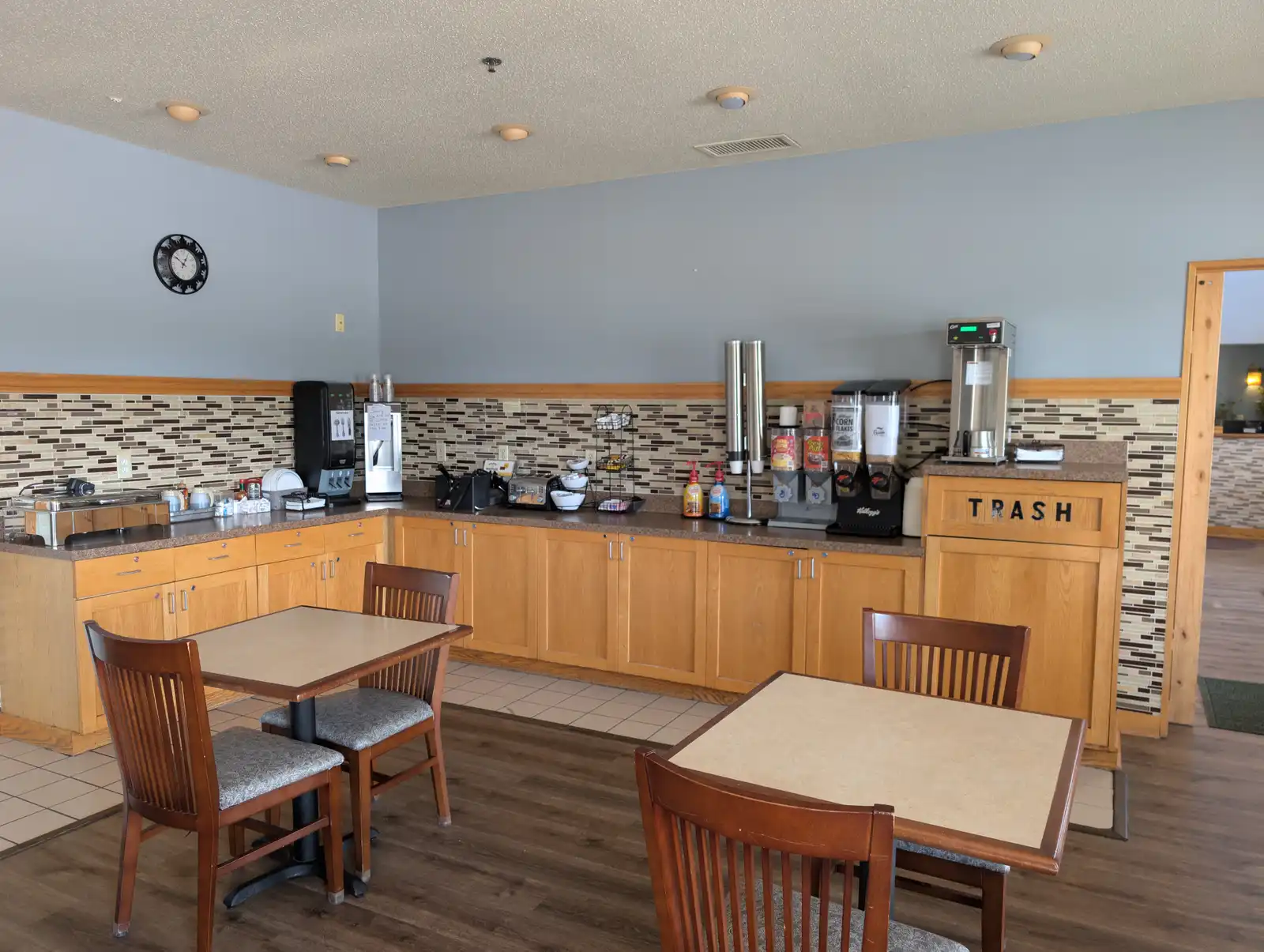 The breakfast counter at Chisholm Inn & Suites, with the waffle station