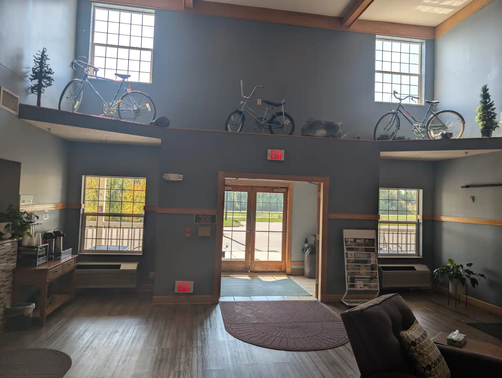 The lobby at Chisholm Inn & Suites, with rental bikes mounted along the wall