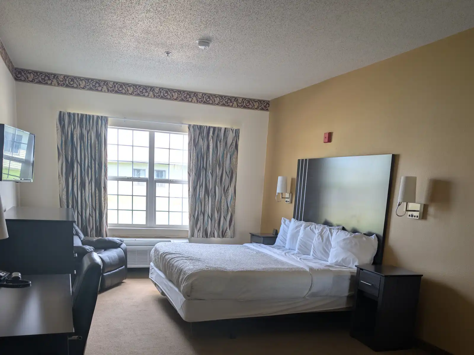 A King Whirlpool Suite at Chisholm Inn & Suites
